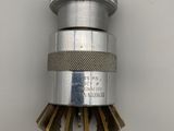a close up of a metal sprinkler on a white surface