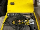 a yellow box with a tool inside of it on a counter