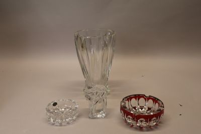 a glass vase and a glass bowl on a table