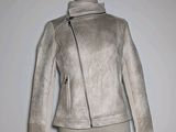 jacket on mannequin dummy on white background with white wall in background