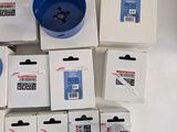 several boxes of different types of tools are sitting on a table