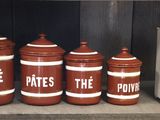 a shelf with many different types of containers on it