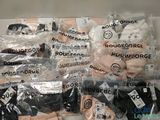 many bags of underwear that are wrapped in plastic