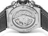 the back of a watch with a black strap on a white background