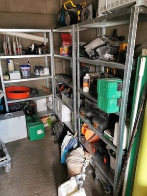 a garage with a lot of tools on the shelves
