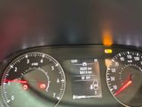 a close up of a car dashboard with a speedometer and gauges