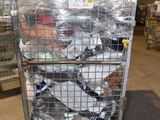 a metal cart with many items in it in a warehouse