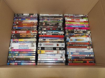 a lot of dvds in a box on the table