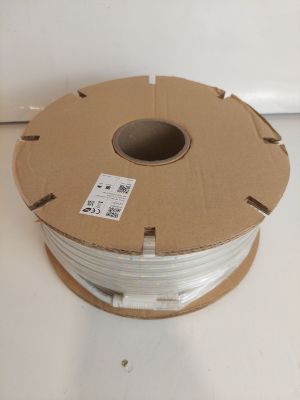 a spool of white wire on a white surface