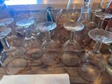 a table with a bunch of empty wine glasses on it