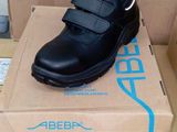 a box with a pair of black shoes on top of it