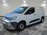 a white van is parked on a checkered floor in a room