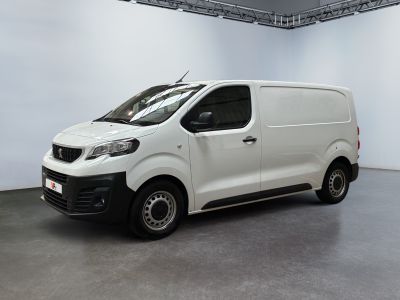 the white van is parked in a large room with white walls