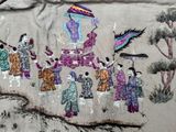 a picture of a group of people with umbrellas on a cloth