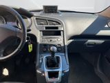 the interior of a car with a steering wheel and dashboard controls