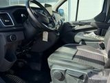 the interior of a vehicle with a luggage bag in the passenger seat