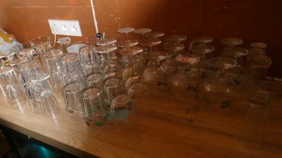 a lot of empty glasses on the table