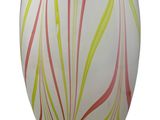 striped glass vase on a white background with red and yellow stripes