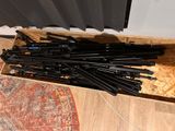 a lot of pens that are sitting in a box on the floor