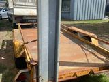 an image of a trailer that is parked in the grass