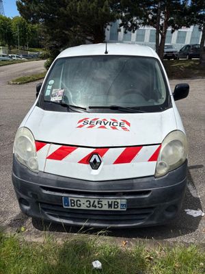 a white van with red stripes parked in a parking lot