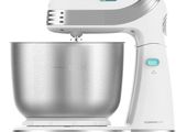 a close up of a mixer on a stand with a bowl
