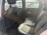 the back seats of a car are empty in a parking lot