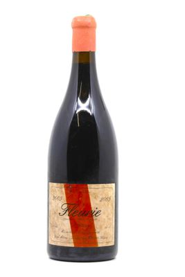 a bottle of wine that is sitting on a table