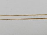 a pair of gold chains on a white background