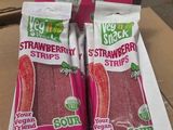 two bags of strawberries in a box on the table