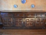 an image of a wooden sideboard in a living room