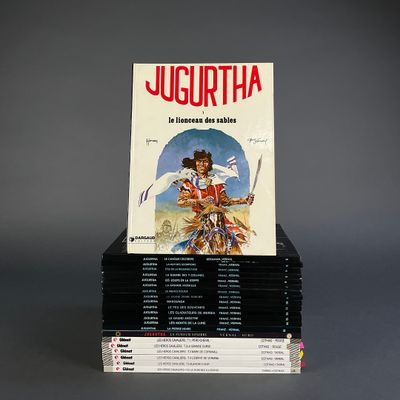 books stacked on top of each other on a gray surface