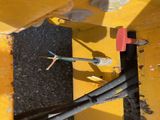 a close up of a piece of metal with wires attached to it
