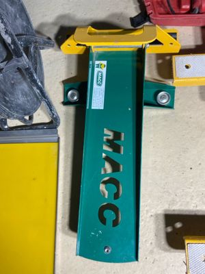 a picture of a green and yellow machine on a floor