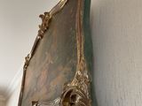 a mirror hanging on the wall next to a window