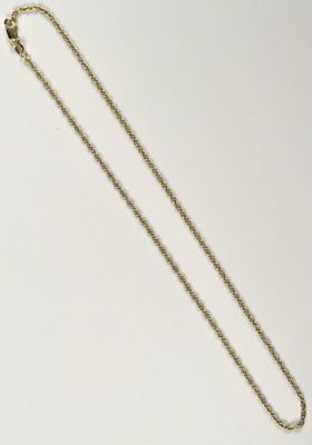 a gold necklace with a chain that has a heart shaped pendant on it