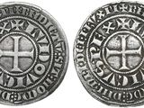 une pièce d'argent avec une croix au recto et une croix au verso