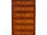 an antique chest of drawers in the style of louis ii