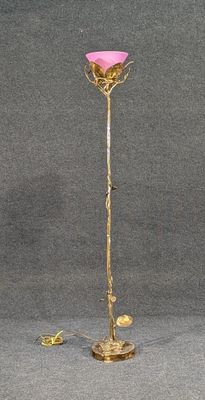 gold plated floor lamp with a pink flower on a stand