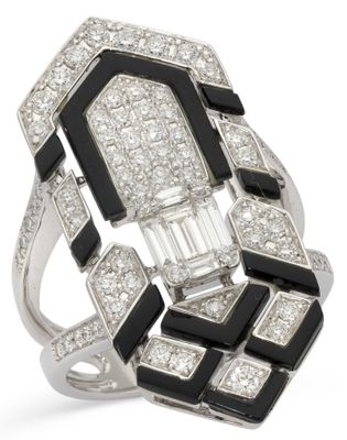 a close up of a diamond and black and white ring