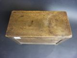 an old wooden box sitting on top of a table