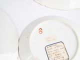 a plate with a note on it sitting on a table