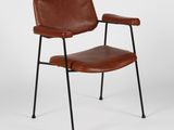 a brown leather chair with black legs and a black metal frame