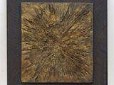 an abstract painting of a sunburst on a wooden surface