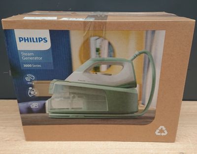 emballage d'un fer à repasser à vapeur Philips dans une boîte posée sur une table