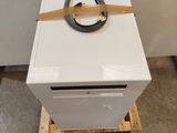 a white box with a black handle on top of a wooden pallet
