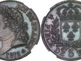 a close up of a coin with a crown on top of it