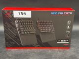 a box with two keyboards in it on a table