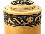 a close up of a wooden container on a white surface