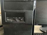 an acer desktop computer sitting on top of a desk next to a keyboard